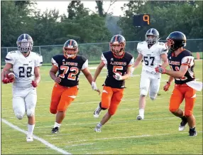  ?? Westside Eagle Observer/MIKE ECKELS ?? Gravette’s Ty Verble (72) forces a Commando running back out of bounds late in the second quarter.