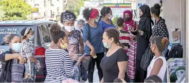  ??  ?? ↑
Dozens of Ethiopian workers gather outside the Ethiopian consulate, inquiring about flights home in Hazmieh, east of Beirut, on Thursday.