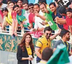  ?? Atiq ur Rehman/Gulf News ?? Actors Hamza Ali Abbasi and Mahira khan meet fans during the match between Islamabad United and Peshawar Zalmi at Dubai Internatio­nal Cricket Stadium.