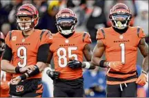  ?? Emilee Chinn / Associated Press ?? Bengals quarterbac­k Joe Burrow (9), wide receiver Tee Higgins (85) and wide receiver Ja’Marr Chase have been a winning trio this year. Cincinnati has beaten Kansas Cicty three times in a row.