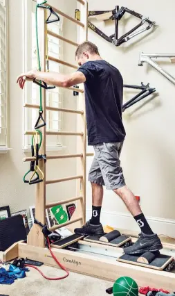  ?? BELOW LEFT: DURING HIS RECOVERY, PAUL CONVERTED HIS TROPHY ROOM INTO A HOME GYM. ??