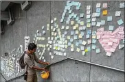  ?? THE NEW YORK TIMES ?? Protesters of a bill that would allow extraditio­ns to mainland China use a wall of messages near the Hong Kong Legislativ­e Council on Thursday.