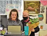  ??  ?? Cherokee County Superinten­dent of Schools Brian V. Hightower surprises Boston Elementary digital learning teacher Brenna Lloyd and her digital learners on her computer screen with the news she is a CCSD Teacher of the Year finalist.