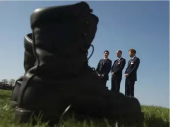  ?? ADRIAN WYLD PHOTOS/THE CANADIAN PRESS ?? Prime Minister Justin Trudeau shares a quiet moment with Prince William and Prince Harry as they take in the scene after arriving at the Canadian National Vimy Memorial for Sunday’s ceremony.