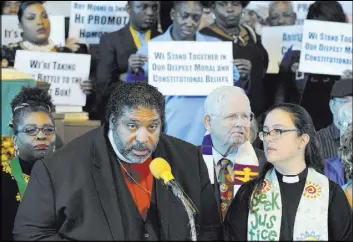  ?? Jay Reeves The Associated Press ?? The Rev. William J. Barber speaks at a rally Saturday in opposition to Republican U.S. Senate candidate Roy Moore at a church in Birmingham, Ala.