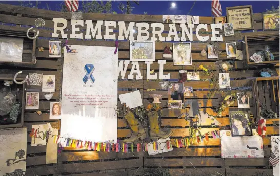  ??  ?? Richard BrianThe Remembranc­e Wall at the Community Healing Garden is seen Nov. 30 downtown. Las Vegas Mayor Carolyn Goodman said the garden serves as a “living memorial.”