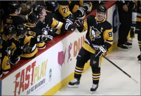  ?? GENE J. PUSKAR - THE ASSOCIATED PRESS ?? Pittsburgh Penguins’ Sidney Crosby (87) returns to the bench after his goal during the third period of an NHL hockey game against the Minnesota Wild in Pittsburgh, Tuesday, Jan. 14, 2020.