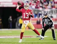  ?? Thearon W. Henderson/Getty Images ?? The San Francisco 49ers' Brock Purdy throws a pass against the Dallas Cowboys during the first half in the NFC divisional playoff game Sunday at Levi's Stadium in Santa Clara, Calif.