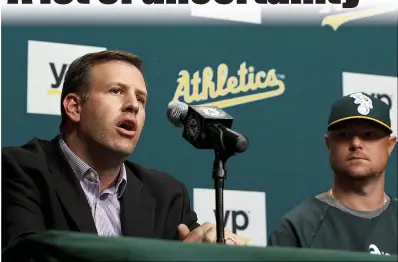  ?? Jason O. Watson
/ Getty Images / TNS ?? General Manager David Forst of the Oakland Athletics speaks next to Jon Lester #31 during a press conference before the game against the Kansas City Royals at O.co Coliseum on Aug. 1, 2014, in Oakland.