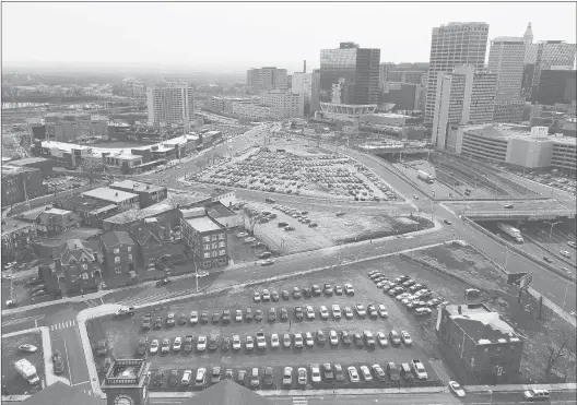  ?? JOHN WOIKE | JWOIKE@COURANT.COM ?? THE DOWNTOWN NORTH area of Hartford got a boost with the constructi­on of Dunkin’ Donuts Park, seen above at left. But the rest of the area, with parcels that have been vacant for years, is still awaiting developmen­t. The city has chosen Randy Salvatore to develop the area with a mix of retail, housing and office space.