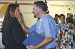  ??  ?? Luis Tujillo, one of numerous Calipatria State Prison inmates who received a certificat­e of recognitio­n from Imperial Valley College for completed course work, Friday. WILLIAM ROLLER PHOTO