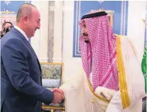  ?? Bandar Algaloud / Courtesy of Saudi Royal Court ?? King Salman greets Turkish foreign minister Mevlut Cavusoglu in Saudi Arabia on Friday.