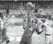  ?? Al Goldis Associated Press ?? NIGEL HAYES (10) of Wisconsin and Nick Ward of Michigan State battle for a rebound.