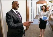  ?? JOHN SPINK/JSPINK@AJC.COM 2015 ?? Atlanta Mayor Kasim Reed (left) stands with his press secretary, Jenna Garland, in September 2015. Garland’s text messages to a city watershed official are being investigat­ed.