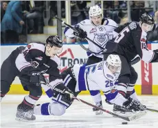  ?? DARREN STONE/VICTORIA TIMES COLONIST ?? The Vancouver Giants’ Brayden Watts grabs the puck in front of the Victoria Royals’ Andrei Grishakov at the Save-On-Foods Memorial Centre in Victoria on Friday night.