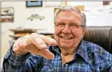  ?? GREG GILBERT / SEATTLE TIMES ?? Fred Foy, 82, of Maple Valley, Wash., holds out his nowsteady right hand earlier this month. He has had a brain implant to control his tremors.