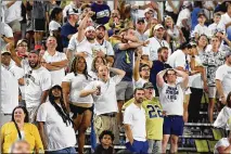  ?? HYOSUB SHIN/HYOSUB.SHIN@AJC.COM ?? This wasn’t the “Welcome back to the stands” Yellow Jackets fans imagined as they react to Northern Illinois’ game-winning twopoint conversion Saturday night to beat Georgia Tech at Bobby Dodd Stadium in Atlanta.