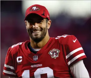  ?? ASSOCIATED PRESS ?? San Francisco 49ers quarterbac­k Jimmy Garoppolo smiles after the 49ers defeated the Minnesota Vikings in an NFL football game in Santa Clara, Calif., Sunday.