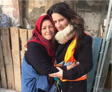  ?? TIA TARIQ ?? Tia Tariq, right, with Khadija at a camp in Leros, Greece. “I pray that she reaches her destinatio­n safely,” Tariq wrote on Twitter.