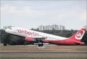  ??  ?? A passenger aircraft, operated by Air Berlin, lands at Tegel airport in Berlin, Germany. Investors believe that Lufthansa will profit from the debt-laden Air Berlin’s break-up.