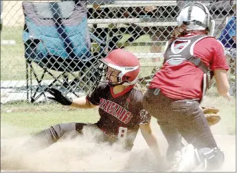  ?? PHOTO BY RICK PECK ?? McDonald County’s Cloee Helm scores the tying run in the Lady Mustangs 8-7 win over Nevada in a scrimmage on Saturday at MCHS. Helm scored the run all the way from second on a sacrifice bunt by Hanna Schmit.