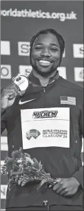  ?? AFP ?? Lyles poses on the podium with his men’s 60m silver medal at the indoor worlds on March 1.