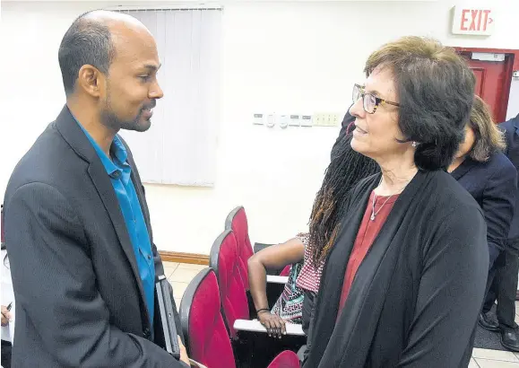  ??  ?? Dr Karen Loch, team leader and professor, internatio­nal business, Georgia State University, with Craig Perue, senior consultant, Centre of Excellence, Mona School of Business and Management (MSBM), at the public lecture on Strategy Transforma­tion Enabled by Informatio­n Technology, hosted by the MSBM on Thursday, March 14.