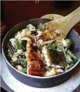  ??  ?? Unagi kama meshi, rice cooked in an iron pot with vegetables and grilled eel.