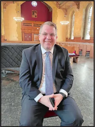  ?? RICK KOSTER/THE DAY ?? Daniel McDavitt, newly appointed director of the Eastern Connecticu­t Symphony Chorus, sits for a photo at Harkness Chapel on the campus of Connecticu­t College.