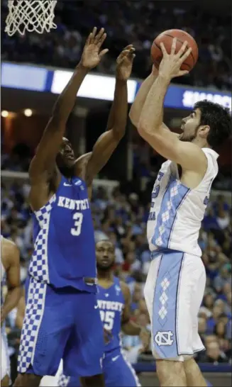  ?? MARK HUMPHREY — THE ASSOCIATED PRESS ?? North Carolina forward Luke Maye, right, shoots against Kentucky forward Edrice Adebayo (3) in the second half of the South Regional final game in the NCAA tournament Sunday in Memphis, Tenn.