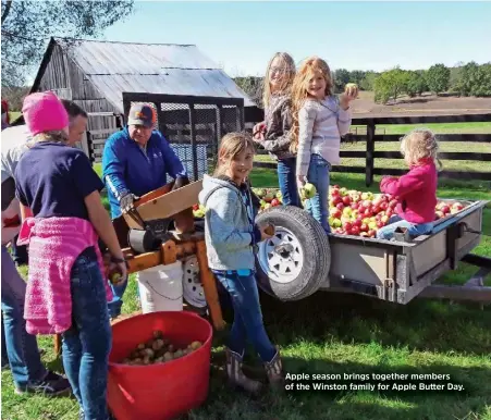  ??  ?? Apple season brings together members of the Winston family for Apple Butter Day.