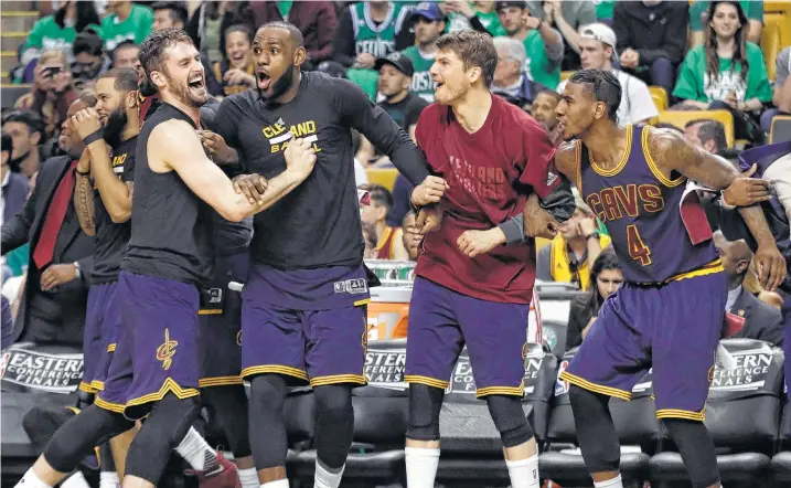  ?? Associated Press file photos. ?? Kevin Durant vs. LeBron James, left, brings a new wrinkle to the Warriors-Cavaliers rivalry. Both teams’ stars have had plenty of time to celebrate on the bench during this year’s playoffs.