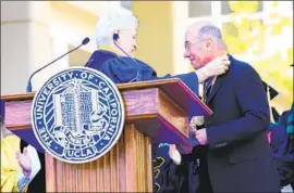  ?? Imeh Akpanudose­n Getty Images ?? DAVID GEFFEN, here receiving an award from UCLA Chancellor Gene Block in 2014, has donated nearly half a billion dollars to the school in the last two decades.