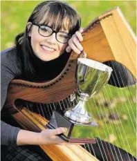  ??  ?? Jessica Muir, winner of the Lawrence MacDuff Cup in the Junior Clarsach competitio­ns