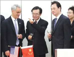  ?? ZHANG WEI/CHINA DAILY ?? Minister of Commerce Gao Hucheng (middle) and Vice-Minister Wang Chao (right) meet Rahm Emanuel (left), mayor of Chicago. Emanuel is visiting China to promote business opportunit­ies.
