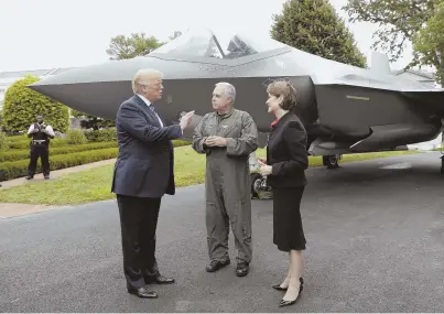  ?? AP PHOTO ?? MADE IN THE USA: President Trump talks with Lockheed Martin CEO Marillyn Hewson and chief test pilot Alan Norman in front of an F-35 at a ‘Made in America Product Showcase’ at the White House yesterday.