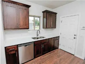  ?? [PHOTOS BY NATE BILLINGS, THE OKLAHOMAN] ?? At right and below is a view of the kitchen at 1713 NE Euclid St. The home is part of an affordable housing program by Progress OKC.