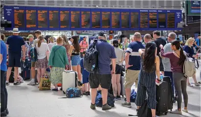  ?? ?? Frustratio­n: Passengers queuing at Glasgow Central yesterday after Tuesday’s cancellati­ons