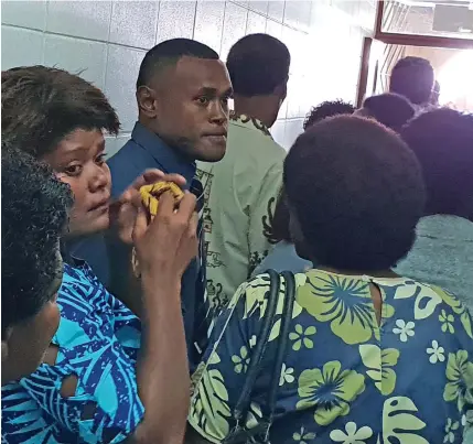  ?? Photo: Nicolette Chambers ?? Amenoni Nasilasila (third from left) surrounded by his family at the High Court in Lautoka on October 21, 2019.