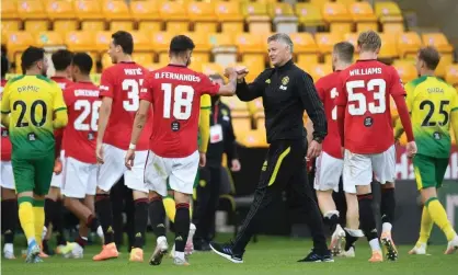  ?? Photograph: Reuters ?? Ole Gunnar Solskjaer congratula­tes his players after Manchester United’s 2-1 FA Cup quarter-final win at Norwich on Saturday