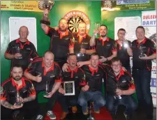  ??  ?? Lantern Bar celebrate their victory in the Premier Division decider.