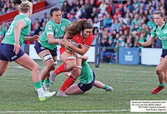  ?? ?? Gwennan Hopkins powered over for a try on her Wales debut PICTURE: Gareth Everett/ Huw Evans Agency