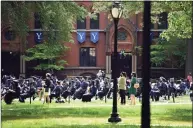  ?? Arnold Gold / Hearst Connecticu­t Media ?? In this file photo, Yale School of Management graduates attend commenceme­nt exercises on Yale University's
Old Campus in New Haven on May 24. Yale ranked in the top five in U.S. News and World Report’s best national universiti­es and value.