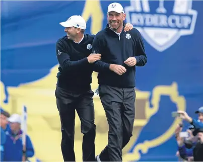  ?? Andrew ?? Thomas Bjorn shares a joke with Sergio Garcia during practice at Gleneagles in 2014.