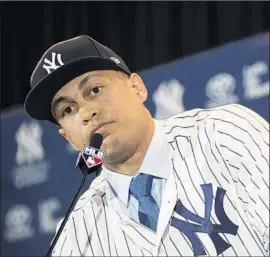  ?? Willie J. Allen Jr. Associated Press ?? GIANCARLO STANTON, the majors’ home run champion in 2017, joins American League home run champion Aaron Judge with the New York Yankees.