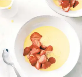  ?? ?? Ripe, sweet organic strawberri­es are served in a pool of crème anglaise, an easy-to-make pouring custard, with a splash of rose water.