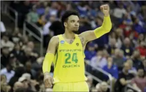  ?? CHARLIE RIEDEL — THE ASSOCIATED PRESS ?? Oregon forward Dillon Brooks celebrates at the end of Thursday’s regional semifinal victory against Michigan on Thursday.