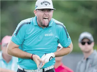  ??  ?? Robert Garrigus, of the U.S., reacts to his tee shot on the 17th hole at the Canadian Open golf tournament at Glen Abbey in Oakville, Ont., on Thursday.