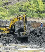  ?? /Reuters ?? Digging for wealth: An excavator at work in the Kamfundwa open pit copper mine, which is owned by state mining company Gecamines.