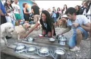  ?? DAVOR KOVACEVIC / REUTERS ?? Preparatio­ns are made for an eating competitio­n at Monty’s Dog Beach Bar in Crikvenica, Croatia.